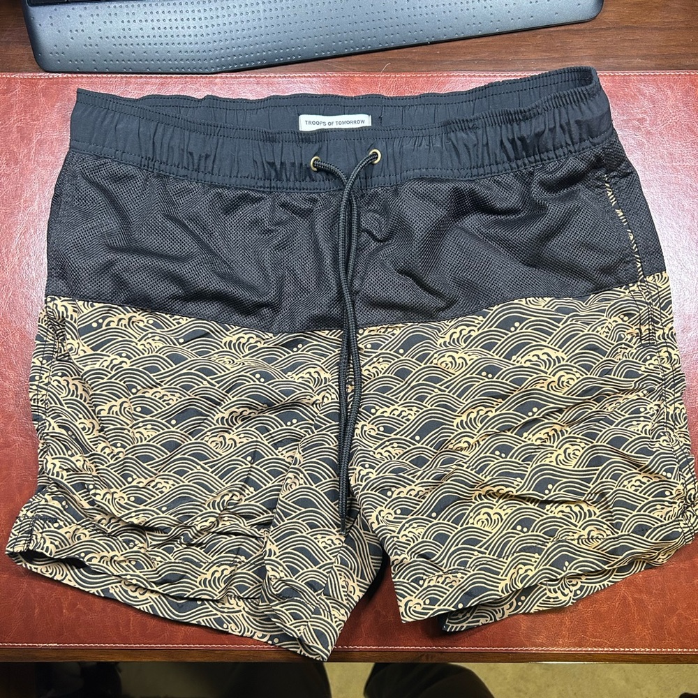 Black and gold swim trunks